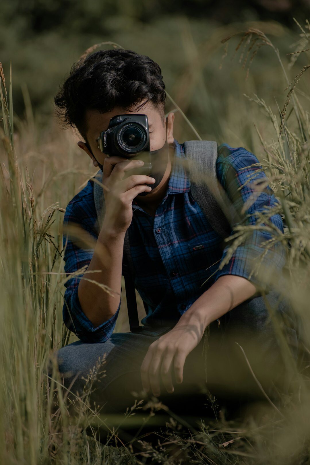 Danish male documentary photographer with a notebook