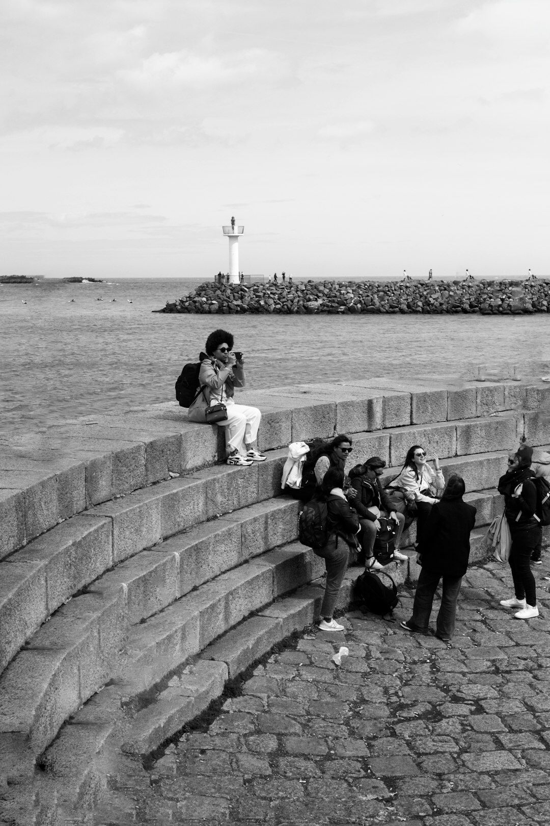Photographer walking through a Danish coastal town with a camera