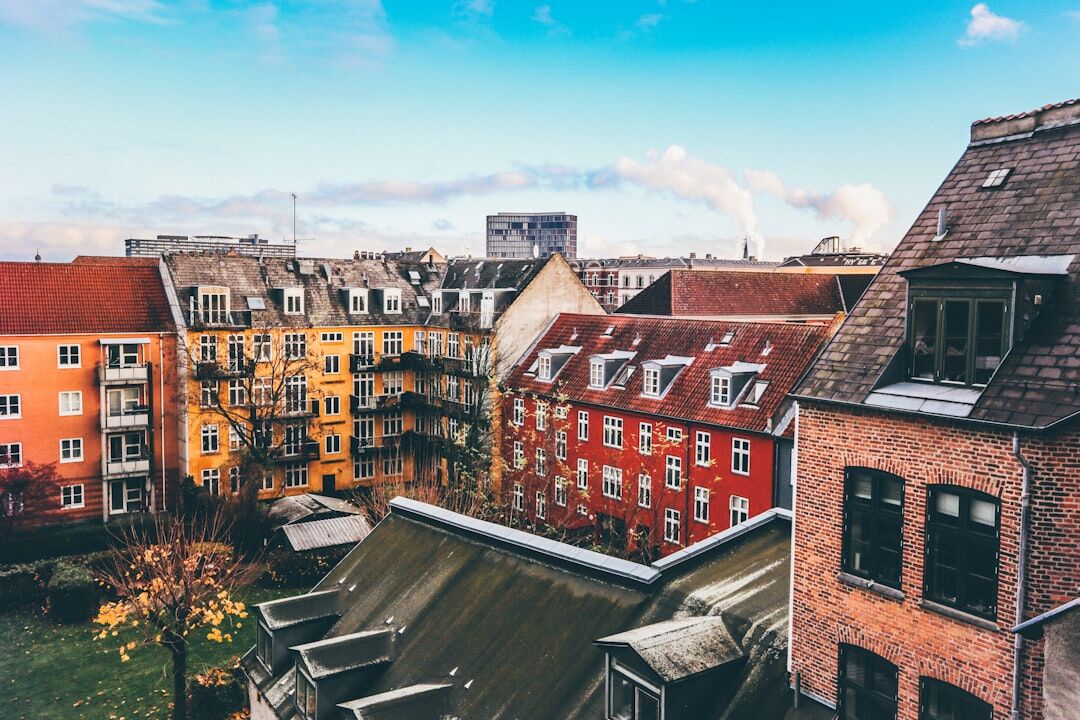 Residents talking in a Copenhagen courtyard neighborhood