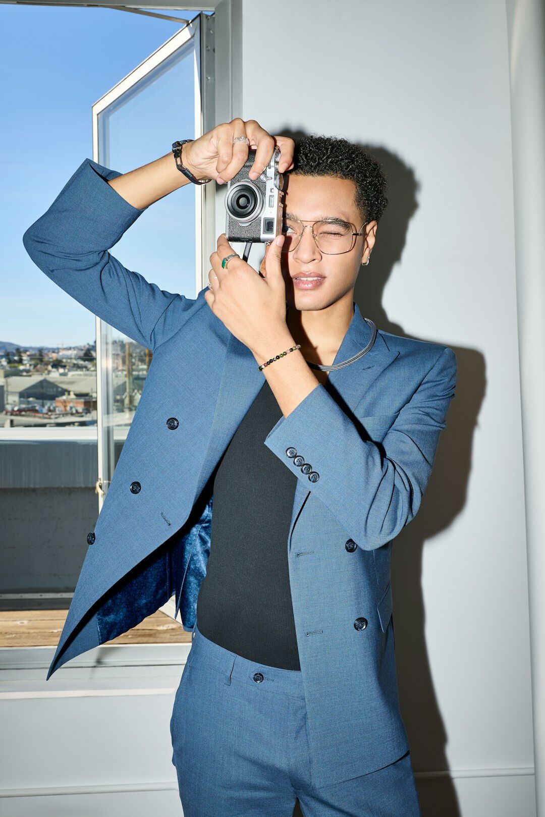 Portrait of a young Danish man with a camera around his neck